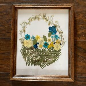 Beautiful dried, floral artwork. It consists of fern, daisies, violets,